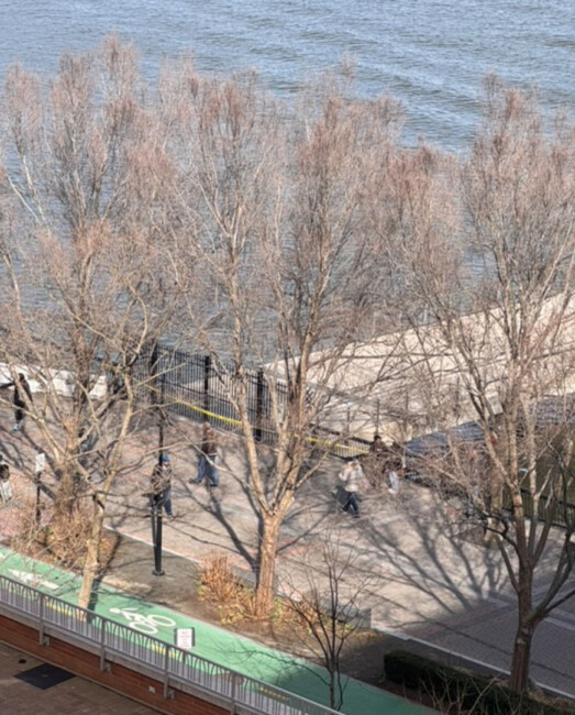 police tape is visible at Pier C in Hoboken on Sunday, March 23rd after reports of a dead body in the water