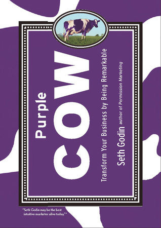Purple Cow by Seth Godin – Purple and white cover with a cow illustration in a framed box.