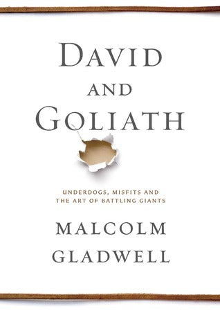 David and Goliath by Malcolm Gladwell – White cover with a torn hole effect in the center.