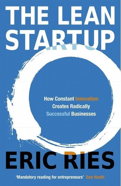 The Lean Startup by Eric Ries – Blue cover with a white circular brushstroke and white text.