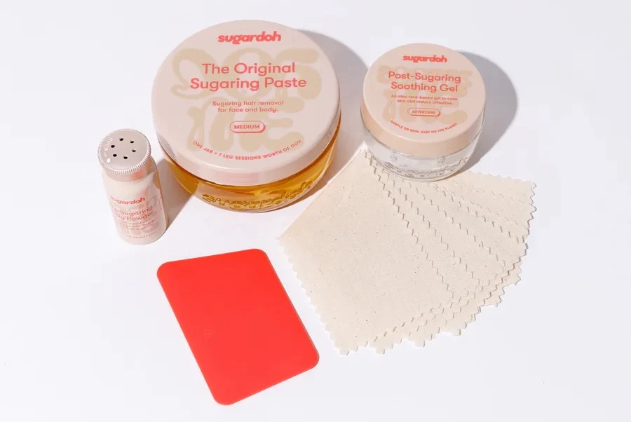 A selection of Sugardoh products in white and red packaging.